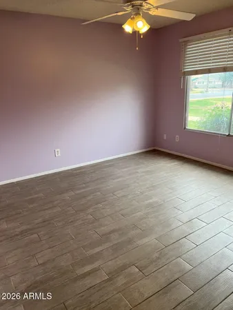 a view of an empty room with a window