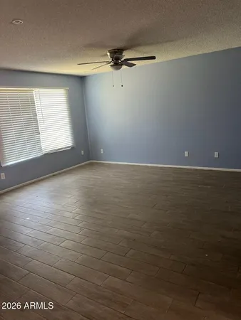 a white toilet sitting next to a bathroom sink and a shower