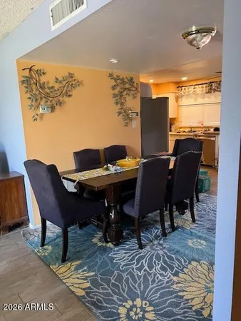 a view of a dining room with furniture and window