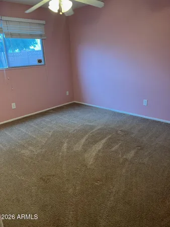 a white toilet sitting next to a shower curtain