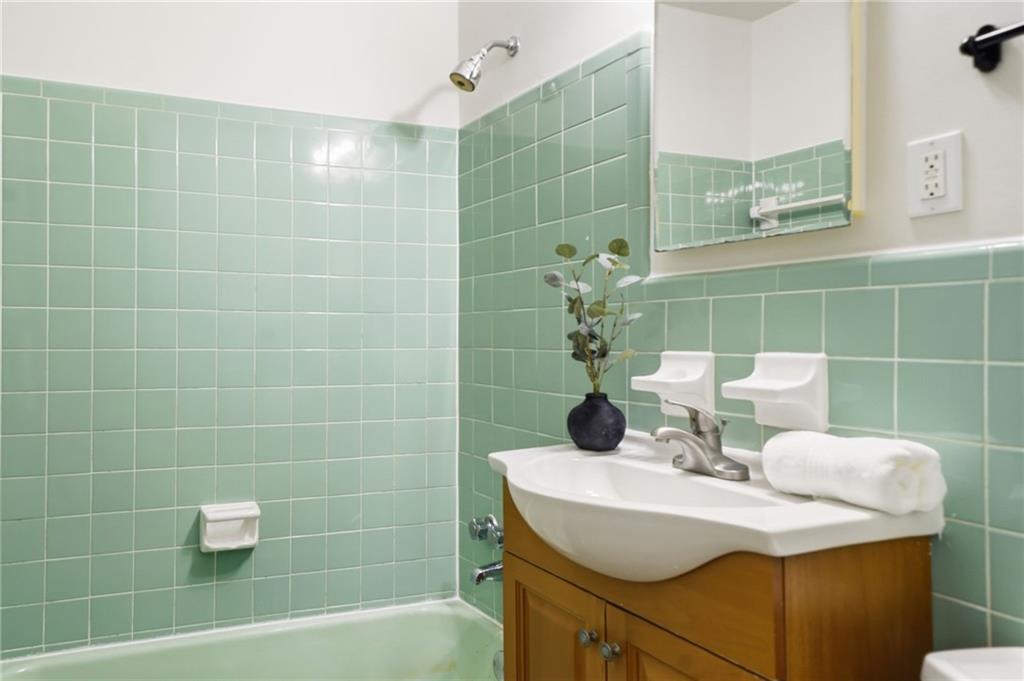 1010 Scott Boulevard, Unit A2 Decatur, GA 30030 - Photo 13 of 23 a bathroom with a sink and a mirror