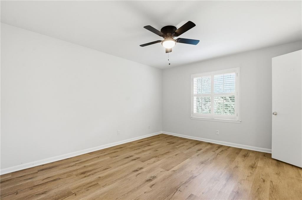 1010 Scott Boulevard, Unit A2 Decatur, GA 30030 - Photo 14 of 23 an empty room with wooden floor and windows