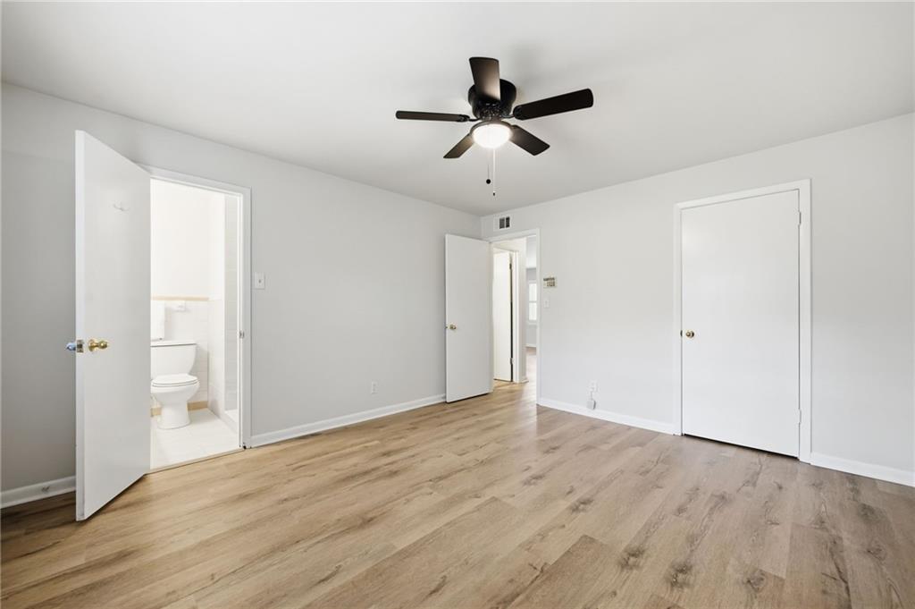 1010 Scott Boulevard, Unit A2 Decatur, GA 30030 - Photo 15 of 23 a view of empty room with wooden floor and ceiling fan