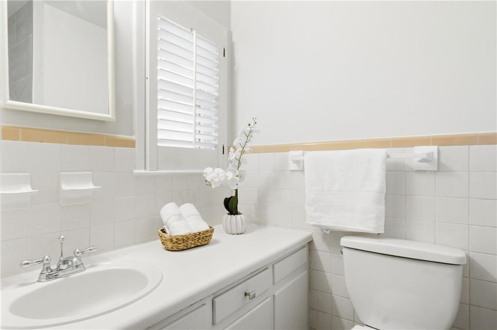 1010 Scott Boulevard, Unit A2 Decatur, GA 30030 - Photo 16 of 23 a bathroom with a granite countertop sink and a mirror