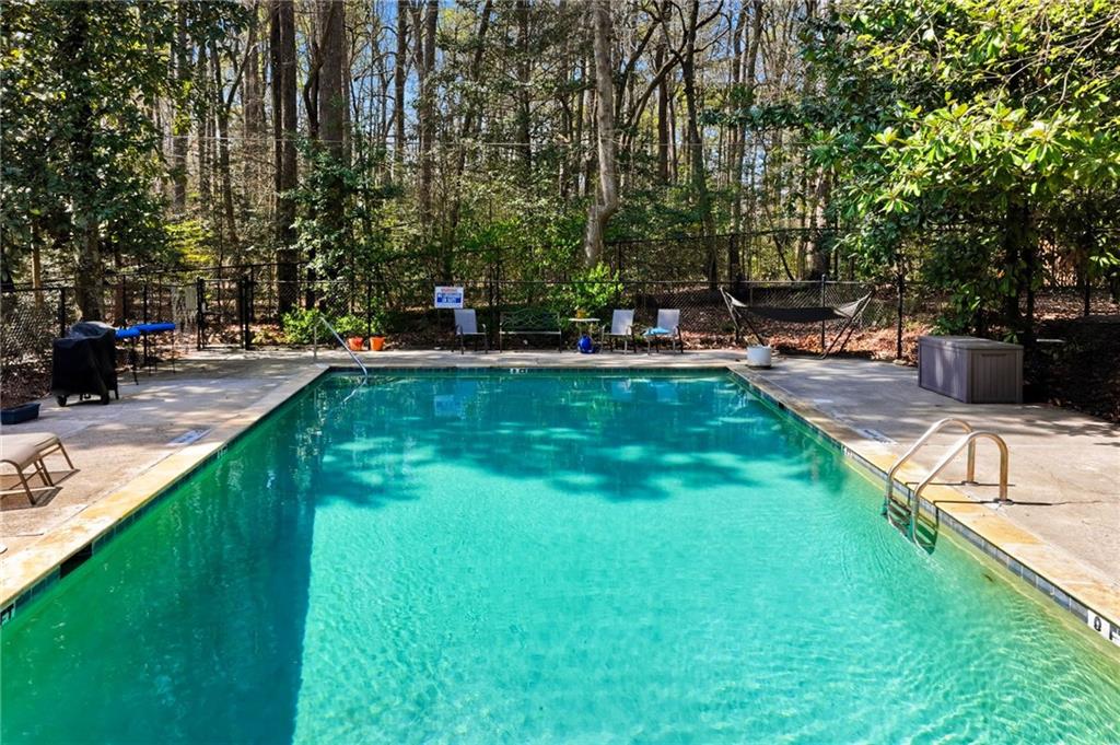 1010 Scott Boulevard, Unit A2 Decatur, GA 30030 - Photo 21 of 23 a view of swimming pool with lawn chairs and plants