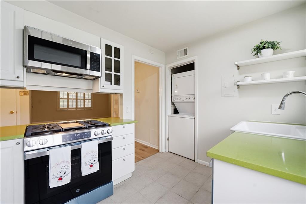 1010 Scott Boulevard, Unit A2 Decatur, GA 30030 - Photo 4 of 23 a kitchen with a stove and a microwave