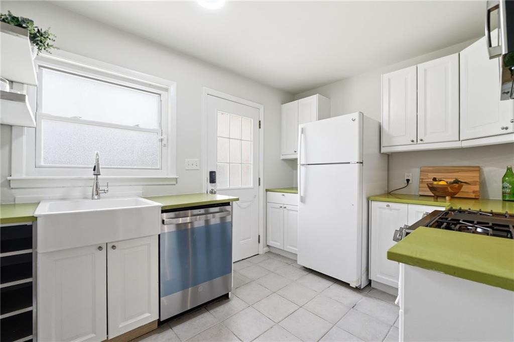 1010 Scott Boulevard, Unit A2 Decatur, GA 30030 - Photo 6 of 23 a kitchen with a sink stove and refrigerator