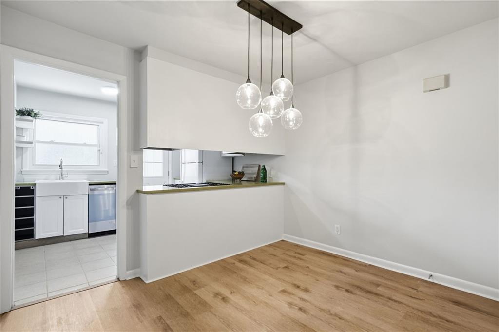 1010 Scott Boulevard, Unit A2 Decatur, GA 30030 - Photo 8 of 23 a view of a kitchen with a sink cabinets and wooden floor