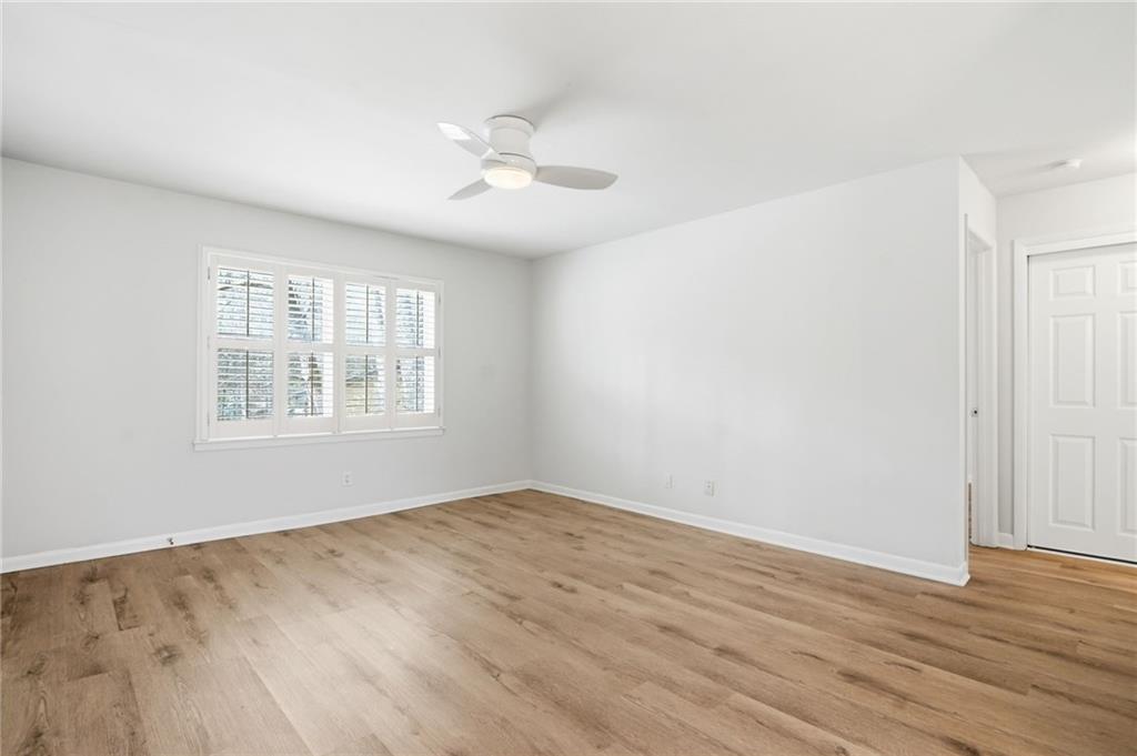 1010 Scott Boulevard, Unit A2 Decatur, GA 30030 - Photo 9 of 23 a view of an empty room with wooden floor and a window