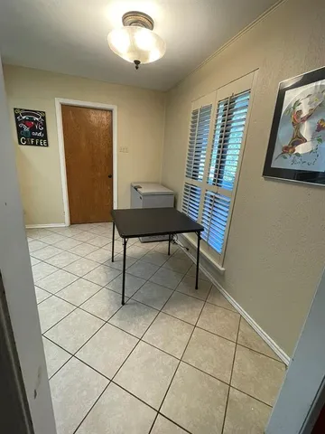a view of a livingroom with furniture and a window