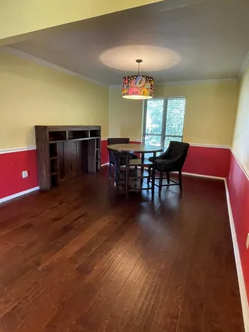 a living room with furniture a dining table and a fireplace
