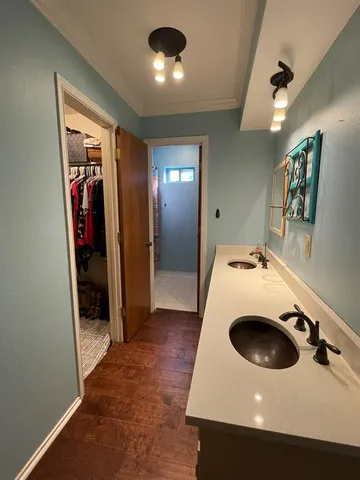 a kitchen with a sink and a refrigerator