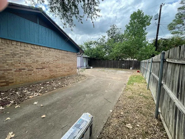 a view of backyard with green space