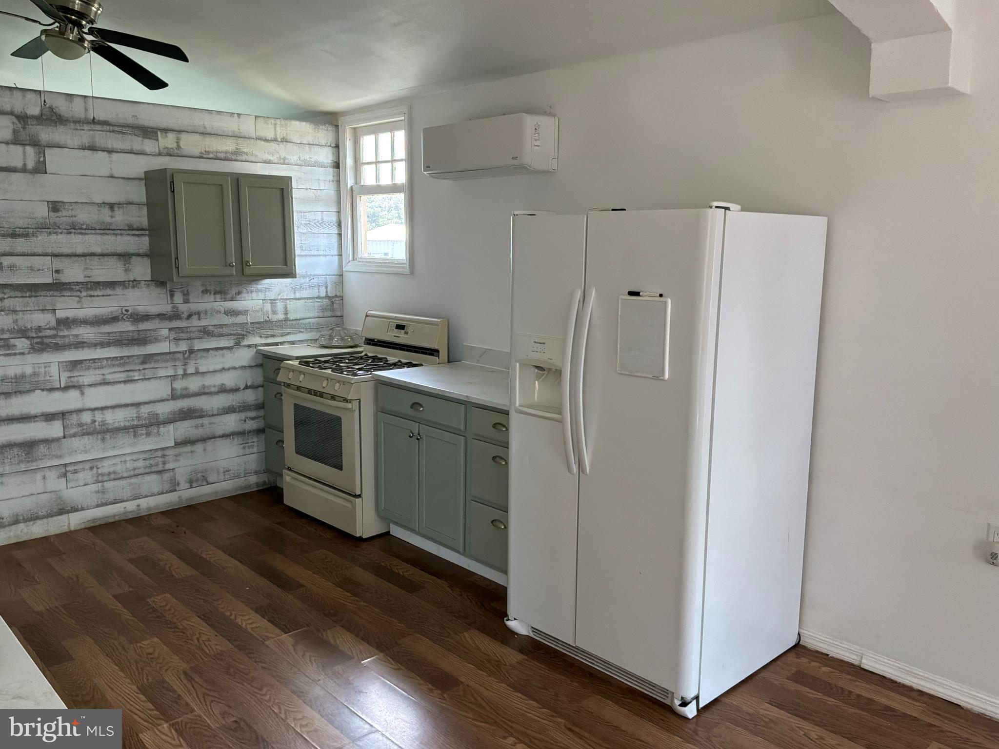 1359 Main Street, Unit B2 Woodside, DE 19904 - Photo 3 of 15 a kitchen with stainless steel appliances a stove a sink and a refrigerator