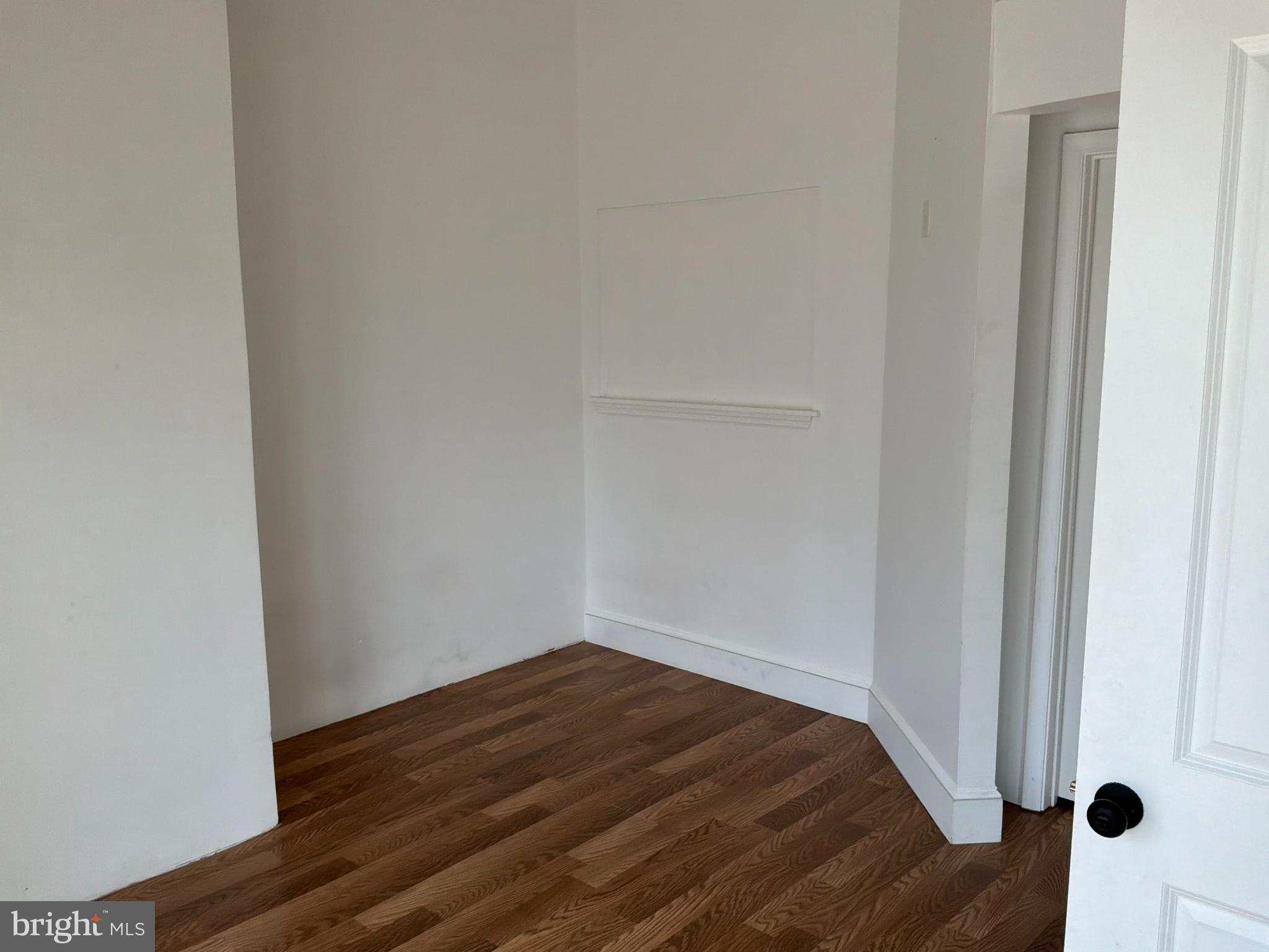 1359 Main Street, Unit B2 Woodside, DE 19904 - Photo 10 of 15 a view of a room with wooden floor