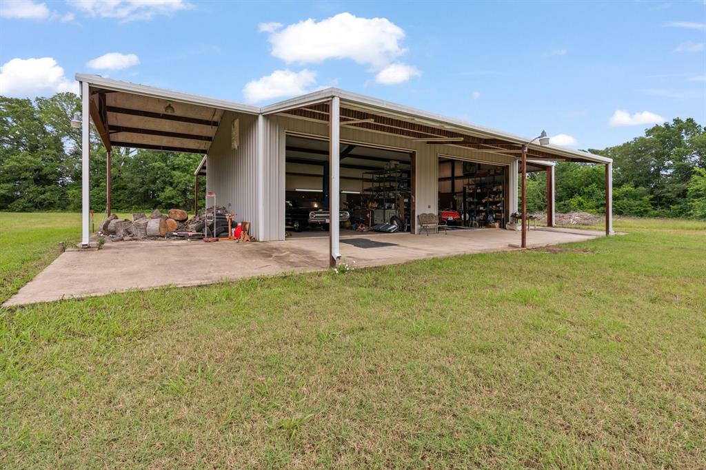 9547 County Road 346 Terrell, TX 75161 - Photo 26 of 37 Front and Left Side of Workshop Featuring Closed Automatic Garage Doors Opened