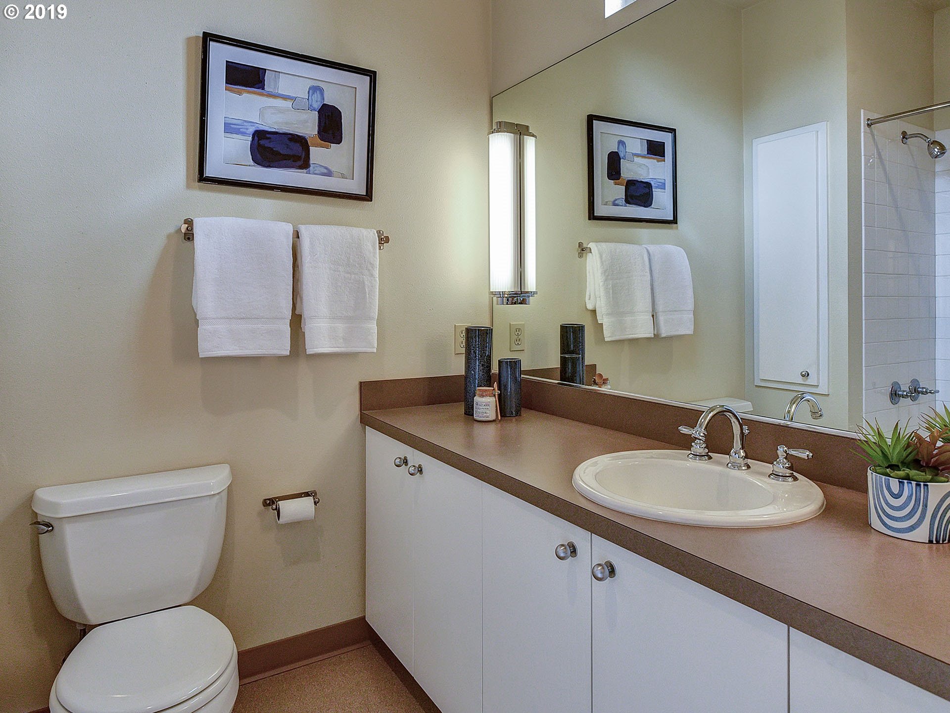 715 Southeast 34th Avenue Portland, OR 97214 - Photo 17 of 24 a bathroom with a toilet sink and mirror