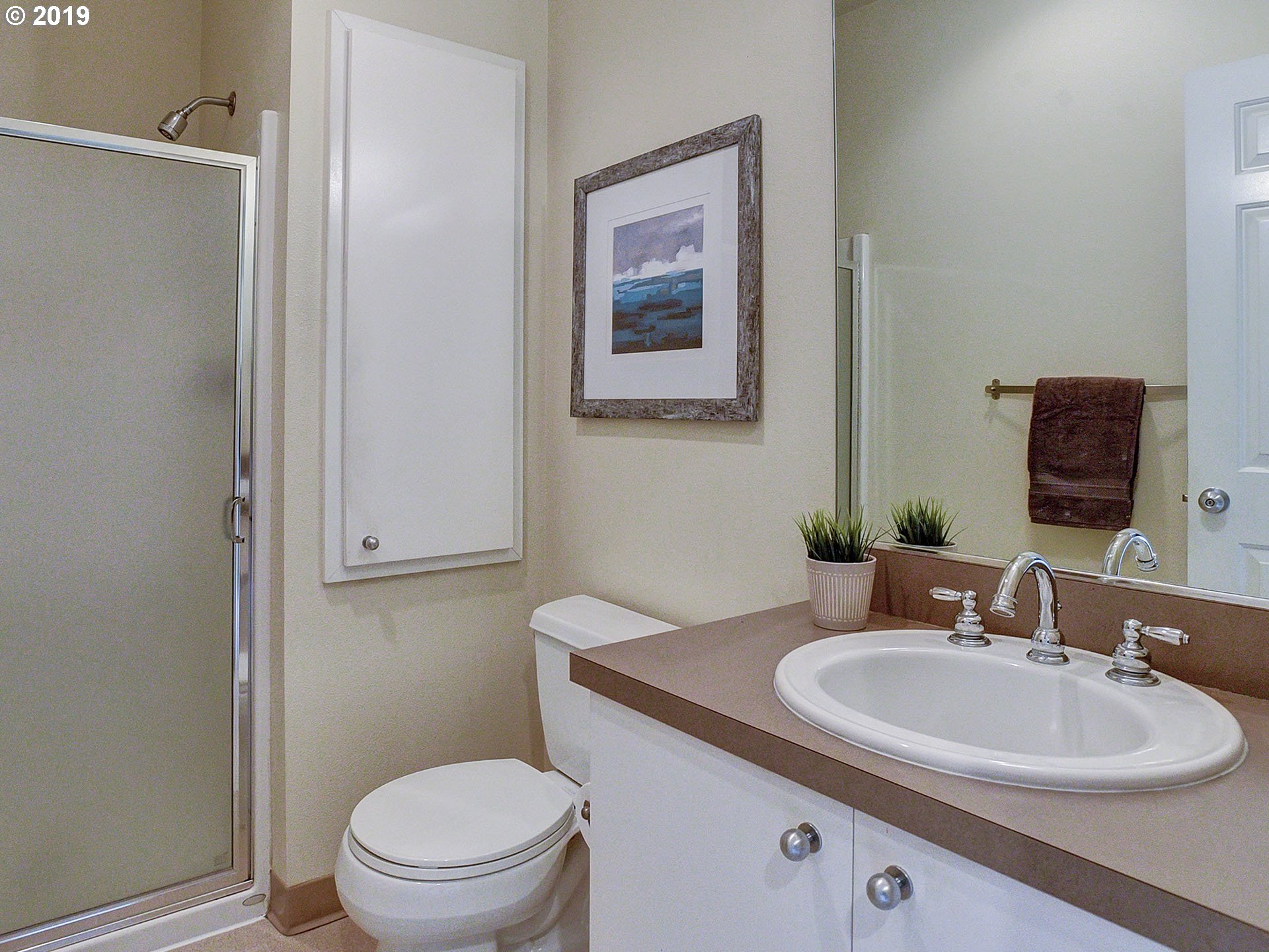 715 Southeast 34th Avenue Portland, OR 97214 - Photo 19 of 24 a bathroom with a toilet sink and mirror