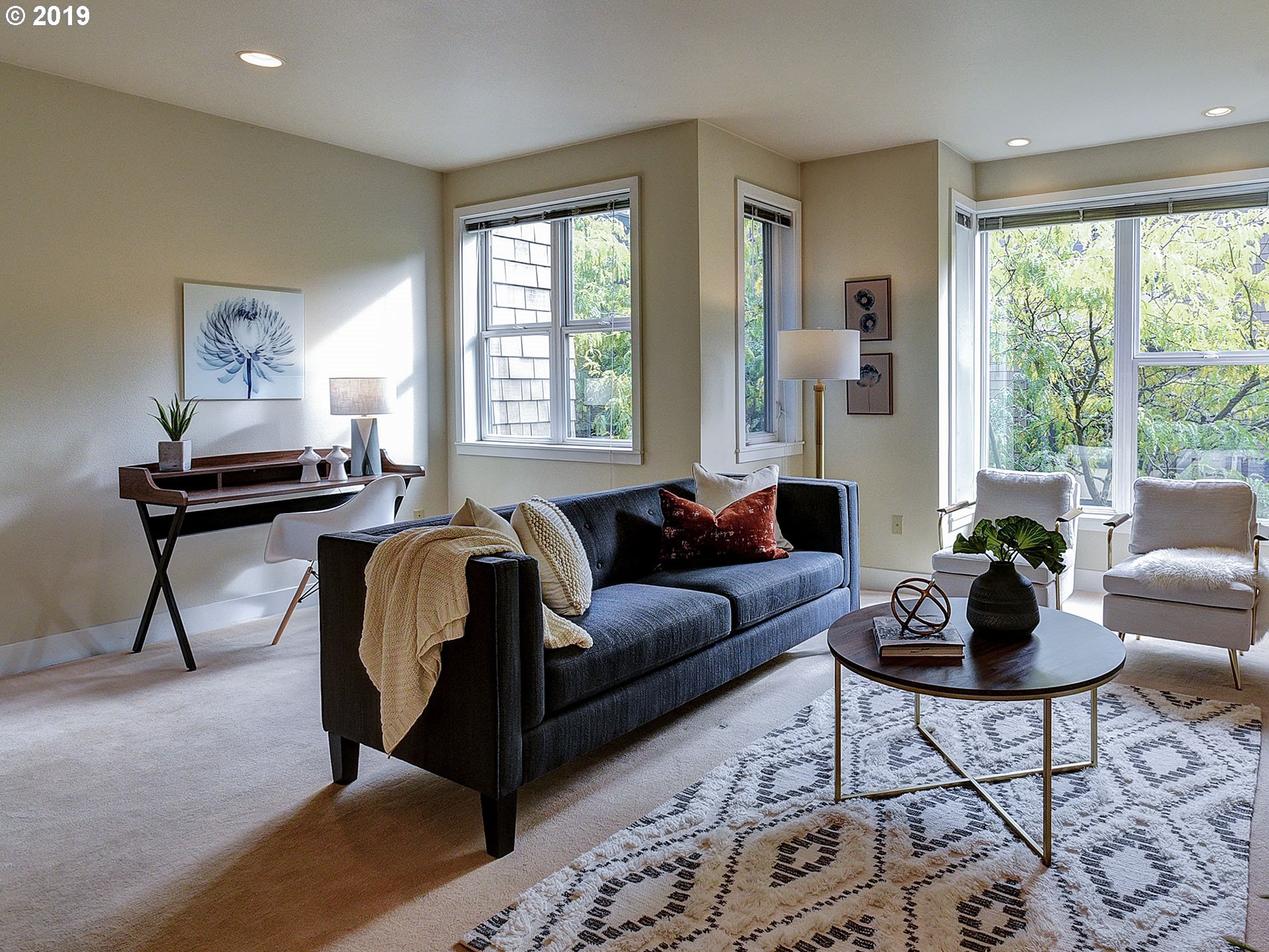 715 Southeast 34th Avenue Portland, OR 97214 - Photo 4 of 24 a living room with furniture and a potted plant next to a window