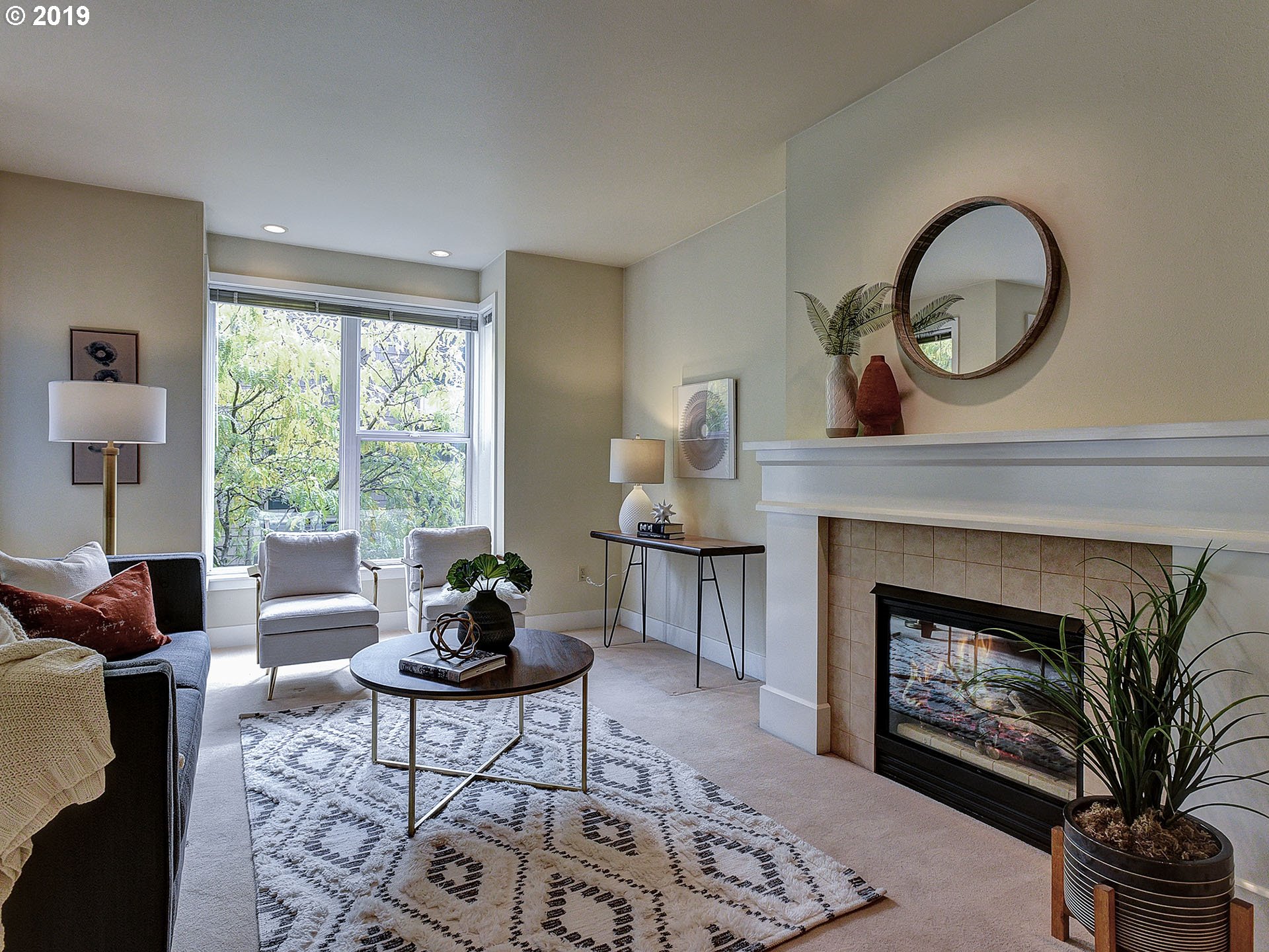 715 Southeast 34th Avenue Portland, OR 97214 - Photo 6 of 24 a living room with furniture a window and a fireplace
