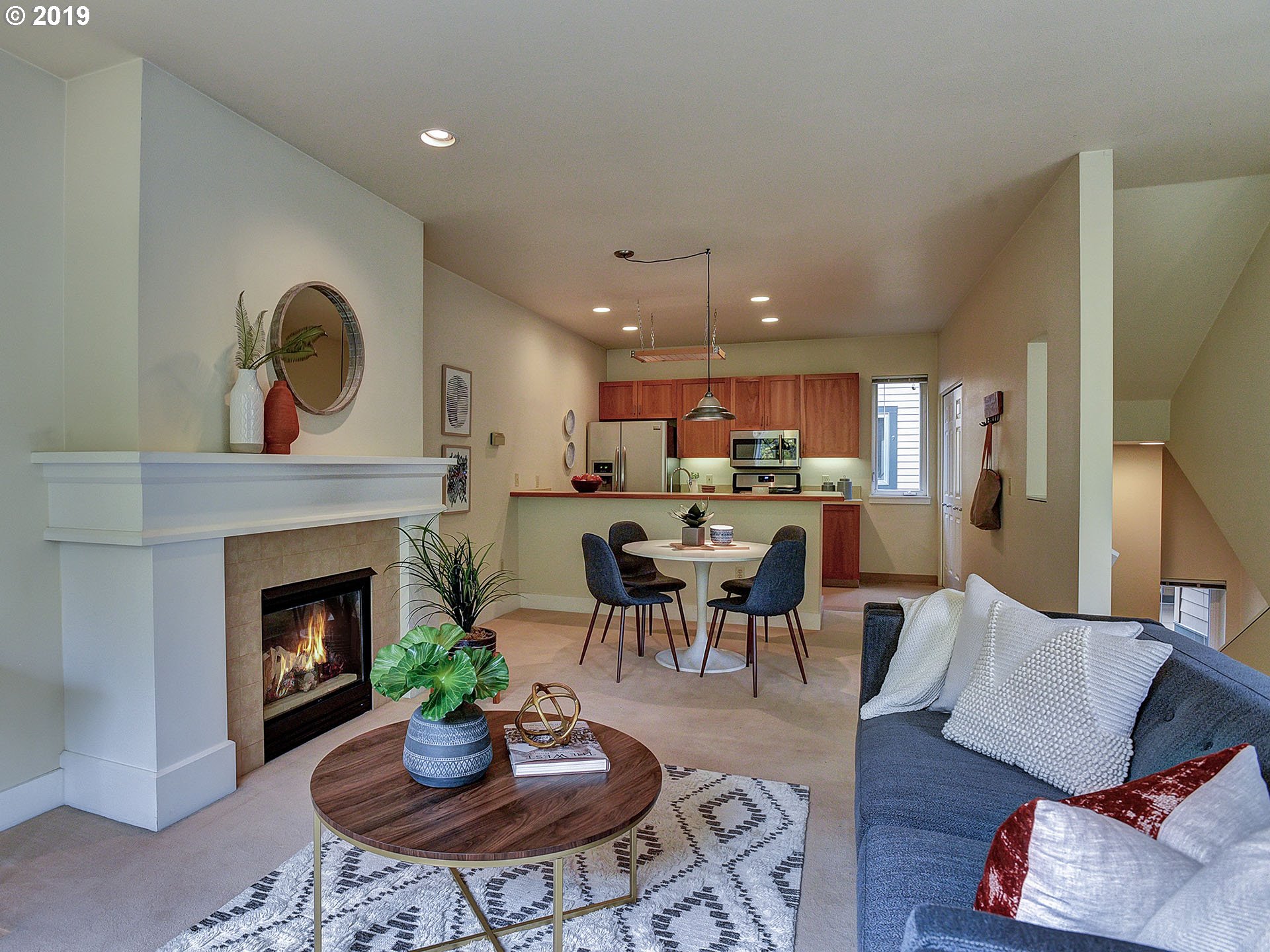715 Southeast 34th Avenue Portland, OR 97214 - Photo 8 of 24 a living room with furniture a fireplace and a table