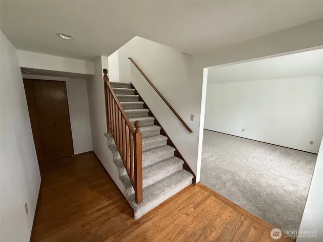 a view of a hallway with staircase