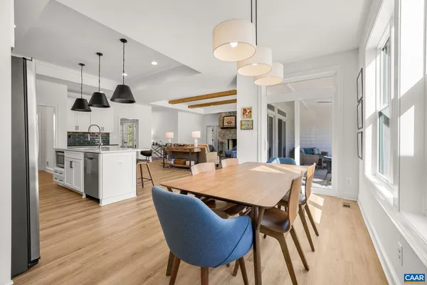 a large kitchen with stainless steel appliances granite countertop a sink and a stove