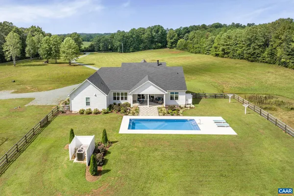 swimming pool view with a lake view