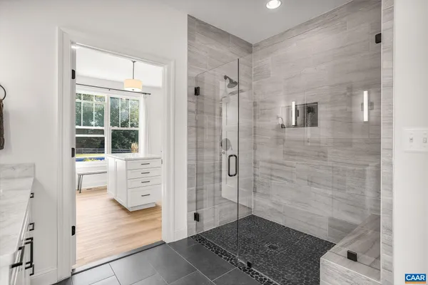 a bathroom with a bathtub and a shower