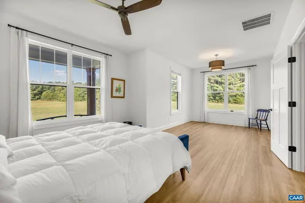 a bedroom with a bed and a desk