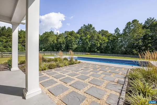 a view of a fountain in front of a house