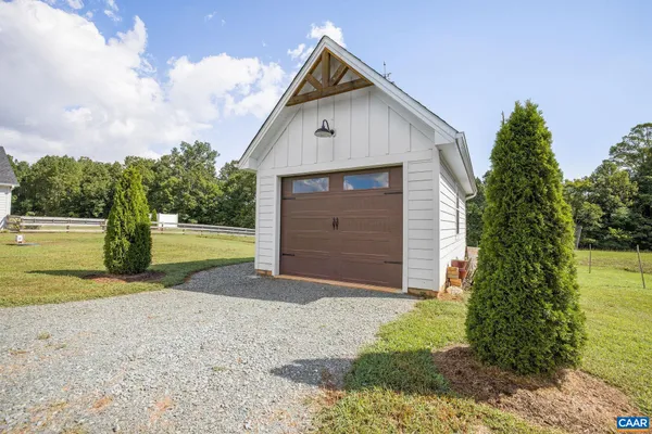 an aerial view of residential houses with outdoor space and swimming pool