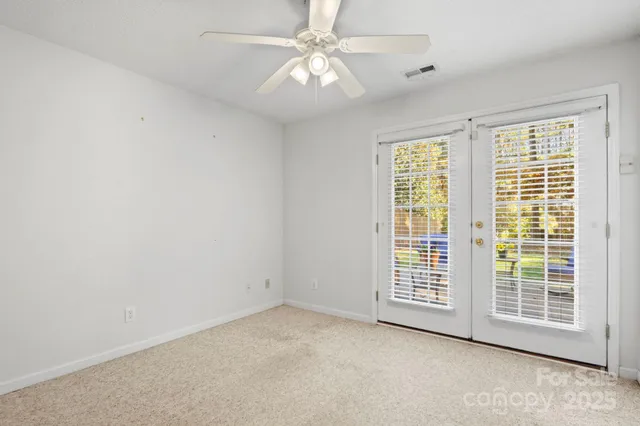 an empty room with a mirror