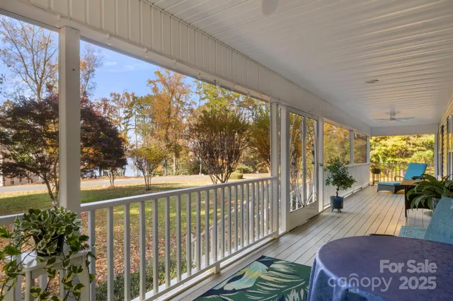 a view of a balcony with wooden floor