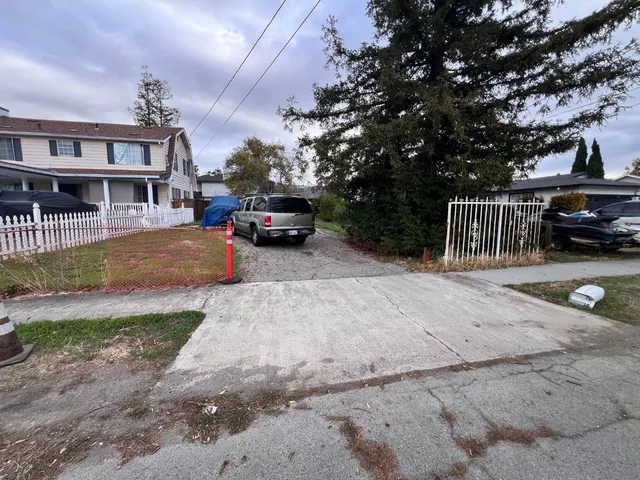 a view of street with parked cars