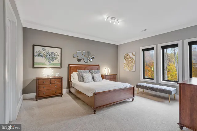 a spacious bathroom with a tub sink and mirror