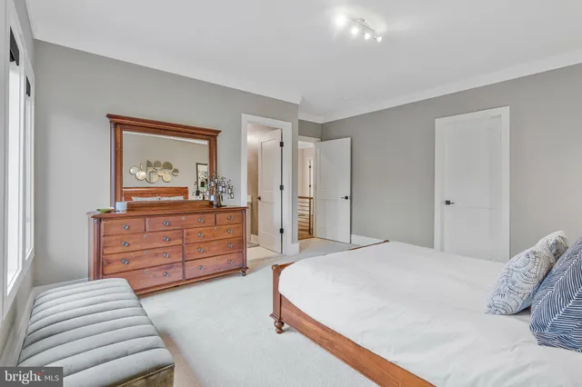 a bathroom with a bathtub a shower and a sink