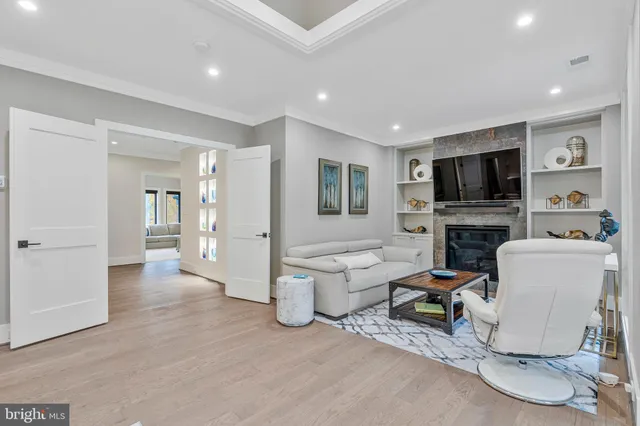 a view of a dining room with furniture wooden floor and chandelier