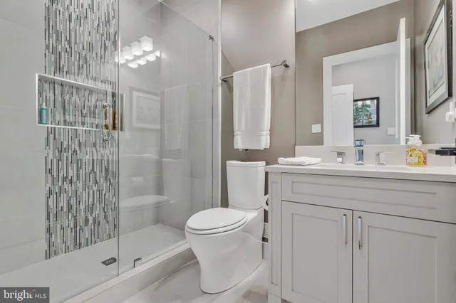 a view of a dining room with furniture and a window