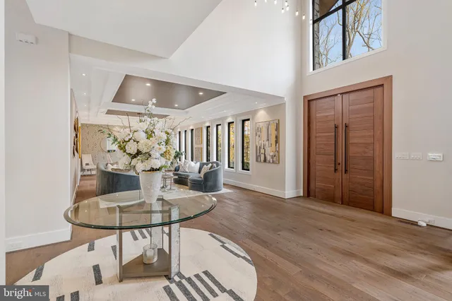 a view of a dining room with furniture wooden floor and chandelier