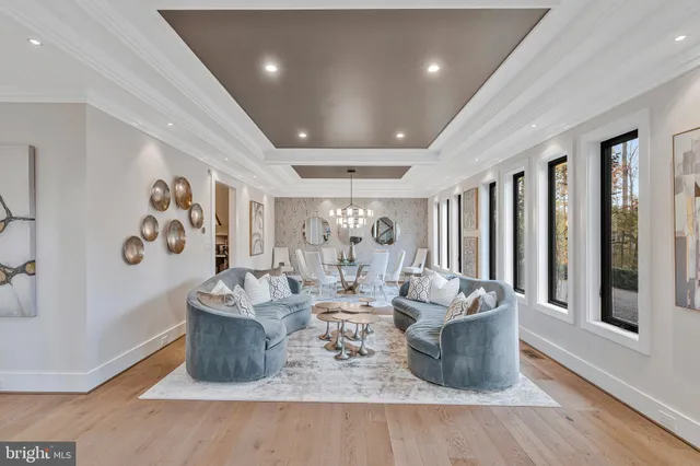 a view of entryway livingroom and hall with wooden floor