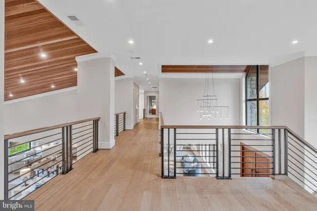 a bathroom with a bathtub shower sink vanity mirror and toilet