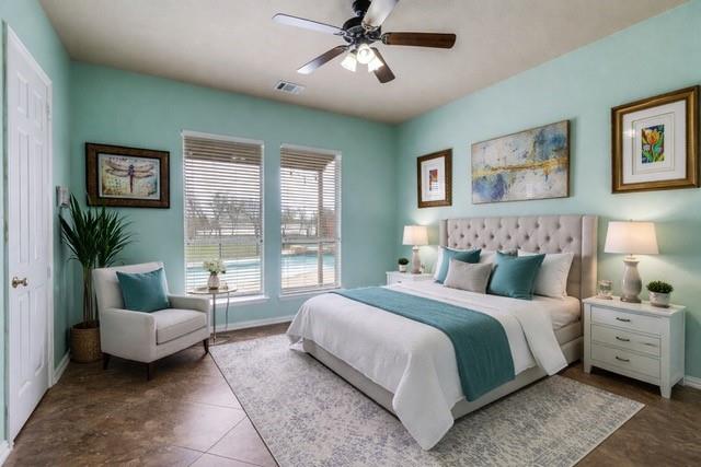 1802 Benedict Court Rowlett, TX 75088 - Photo 11 of 30 a bedroom with a large bed couch and a window