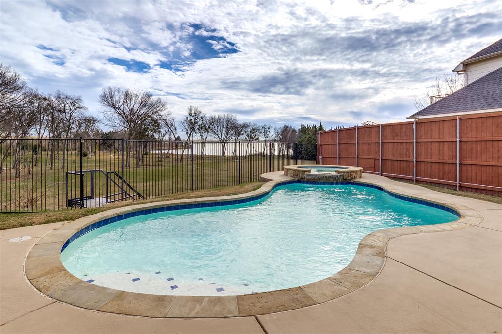 1802 Benedict Court Rowlett, TX 75088 - Photo 23 of 30 a view of a swimming pool with a lake
