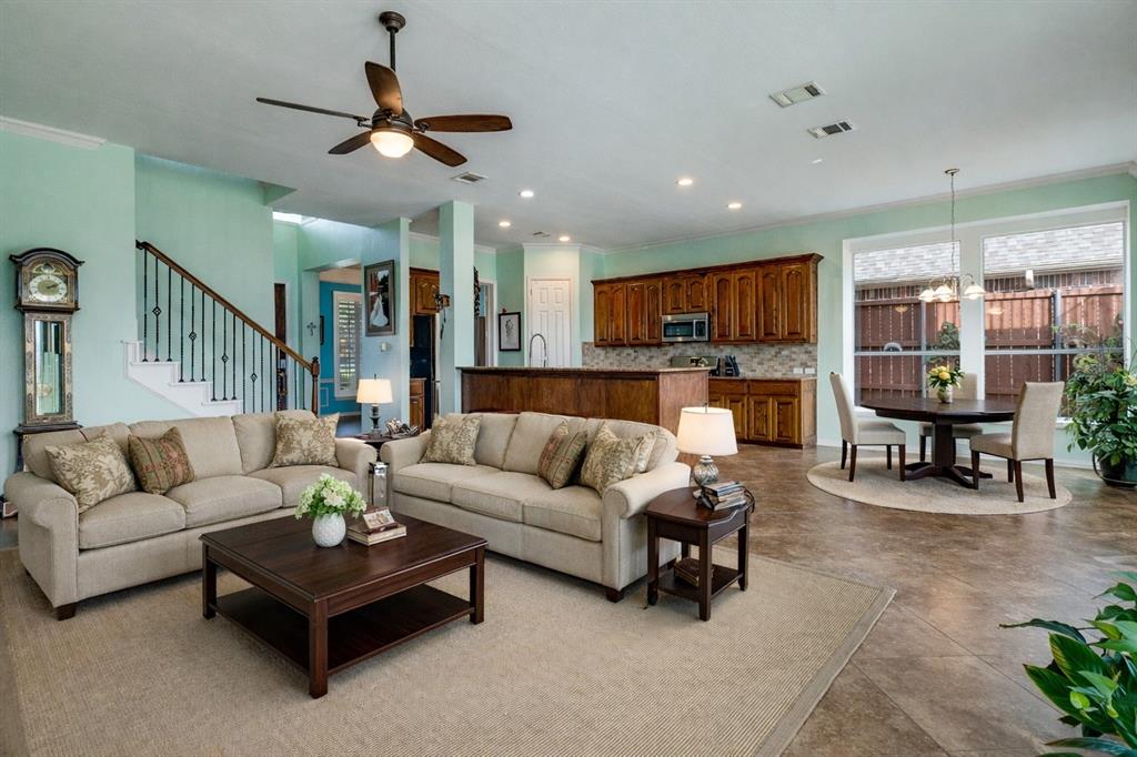 1802 Benedict Court Rowlett, TX 75088 - Photo 7 of 30 a living room with furniture kitchen view and a wooden floor