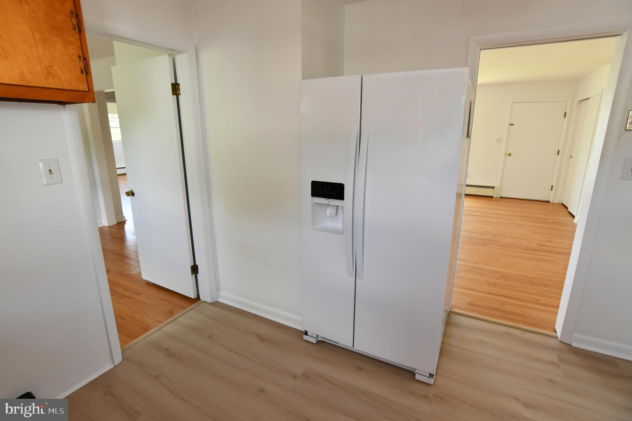 437 Beechcroft Road Winchester, VA 22601 - Photo 20 of 52 an empty room with wooden floor and a bathroom