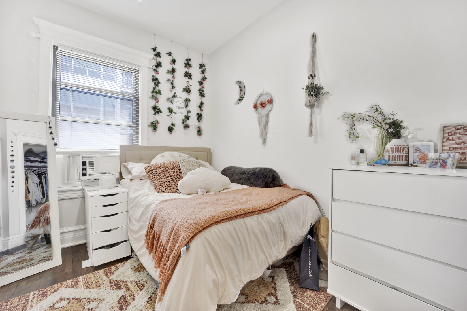 3934 North Sheridan Road, Unit 3 Chicago, IL 60613 - Photo 5 of 12 a bedroom with a bed and a window