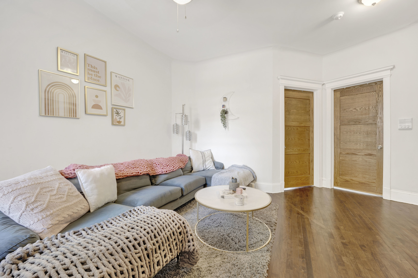 3934 North Sheridan Road, Unit 3 Chicago, IL 60613 - Photo 6 of 12 a living room with furniture and wooden floor