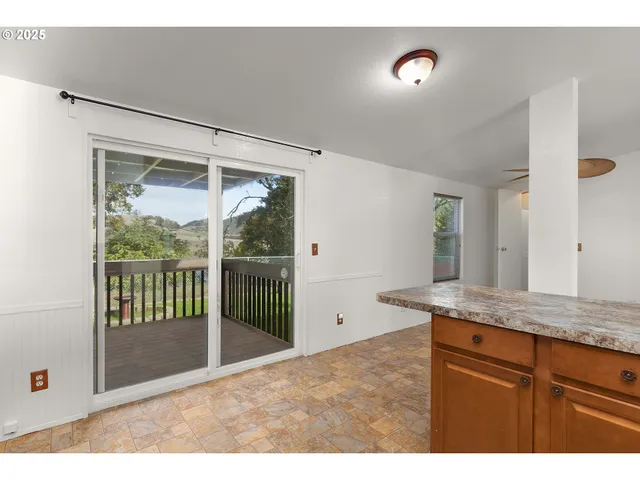 a view of bathroom with a tub and mirror