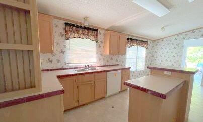 181 Wild Oak Road Southeast Cleveland, TN 37323 - Photo 4 of 12 a kitchen with a sink cabinets and window